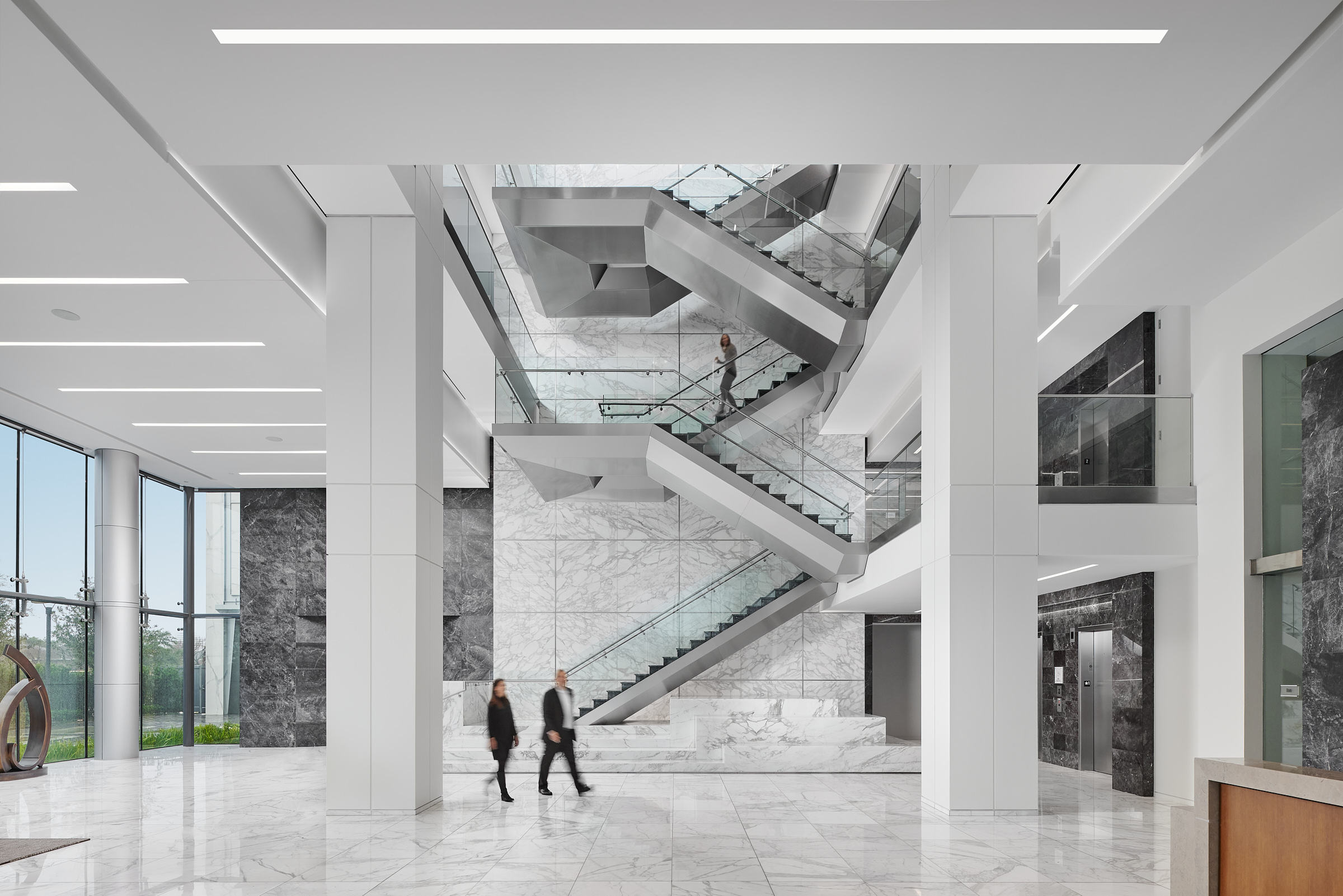 Main entry and monumental stair of SCB's The Hanover Company. Interior Design. Workplace.